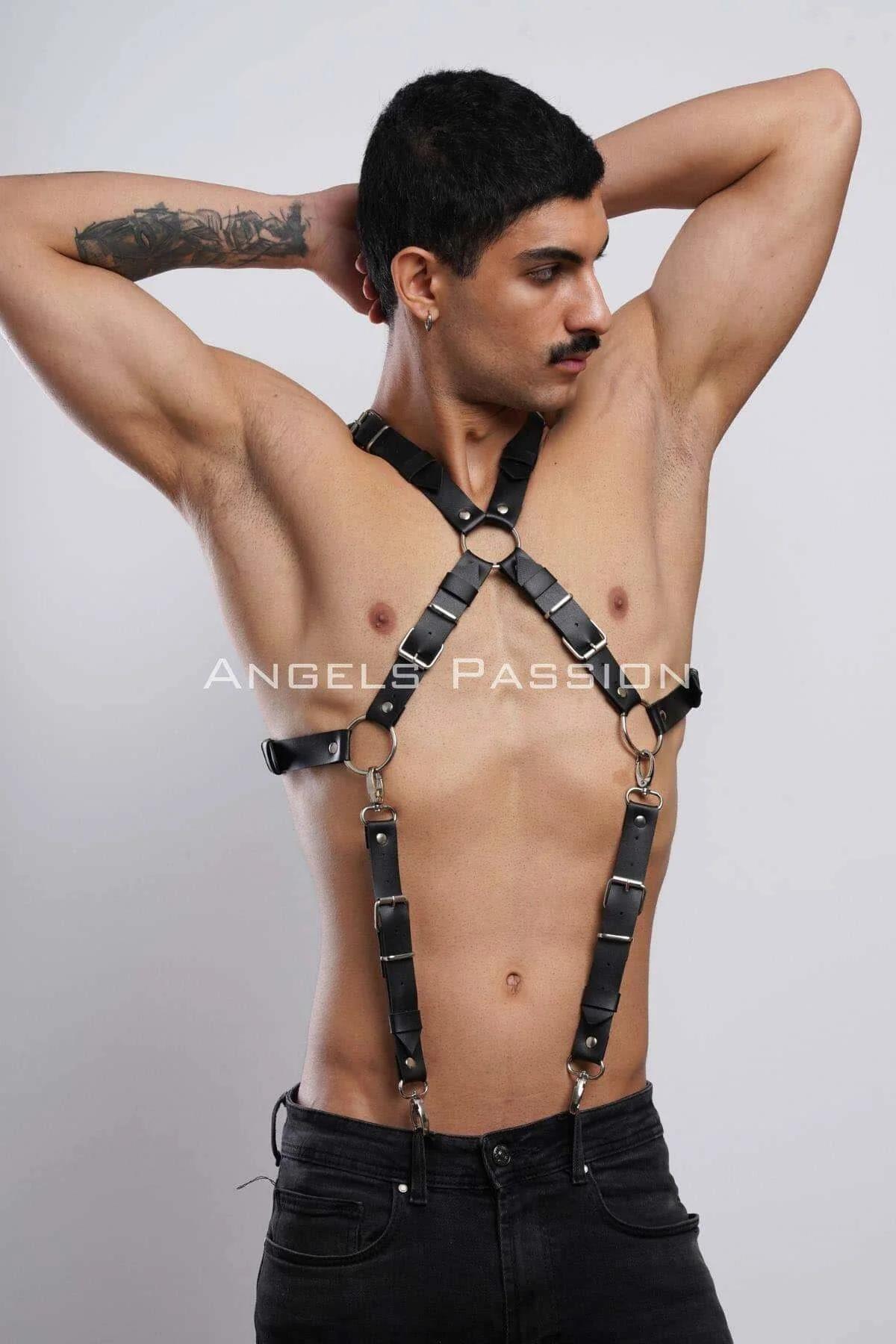 close-up of gold-tone O-ring junction on black faux leather chest harness cross-strap detail