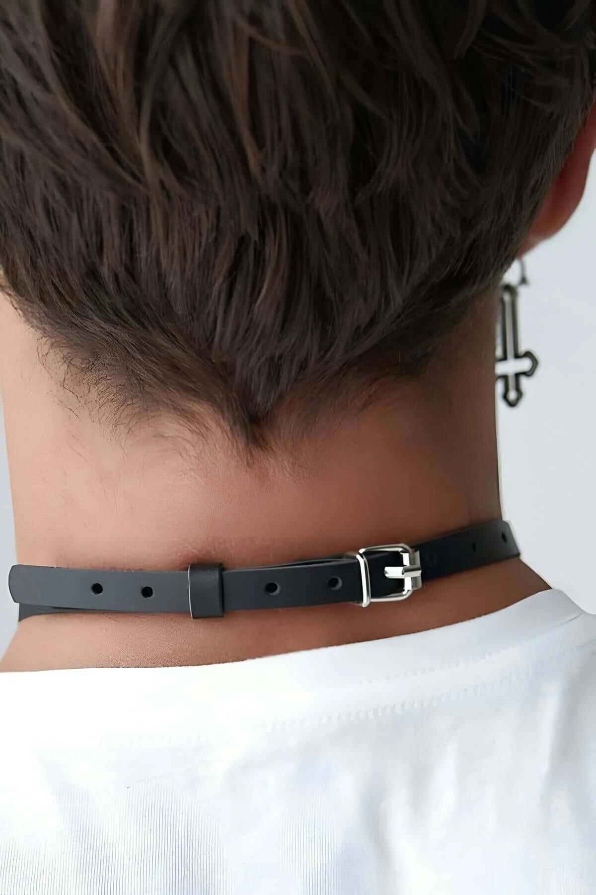 Close-up of black PU leather choker band showing smooth matte surface texture and flat 1.5 cm width