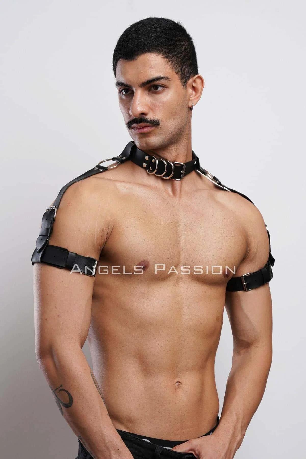 Black shoulder band with silver buckle hardware on upper arm, side view