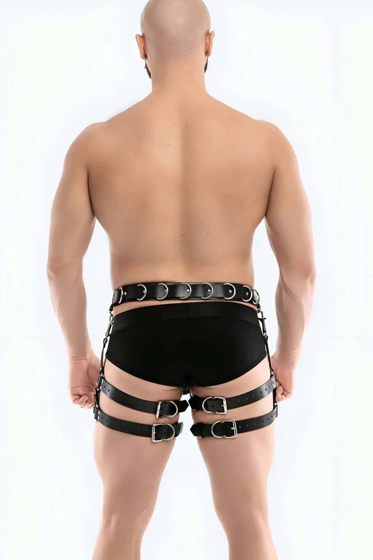 close-up of silver rectangular buckle and dual D-rings on black PU leather waist belt