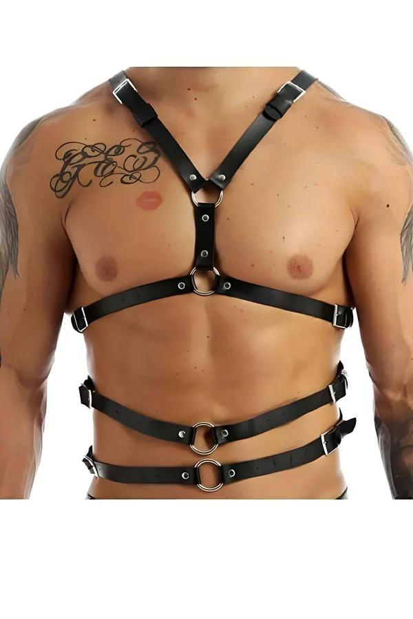 Black faux leather chest harness with Y-strap, three silver O-rings and six buckles worn on male torso