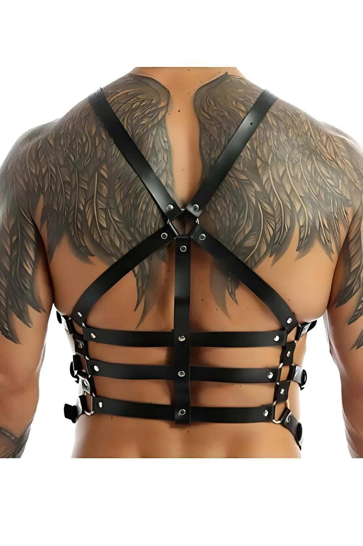 Close-up of silver O-ring at center chest on black PU leather harness with rectangular buckles