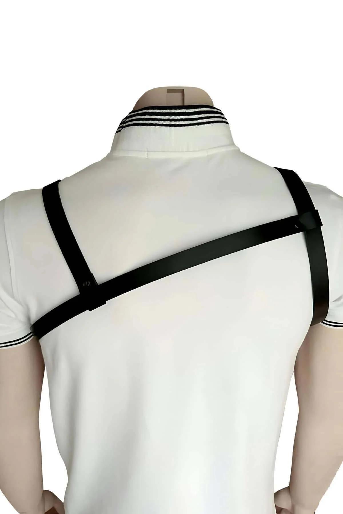 men's black body harness layered over fitted polo shirt showing buckle adjustment points