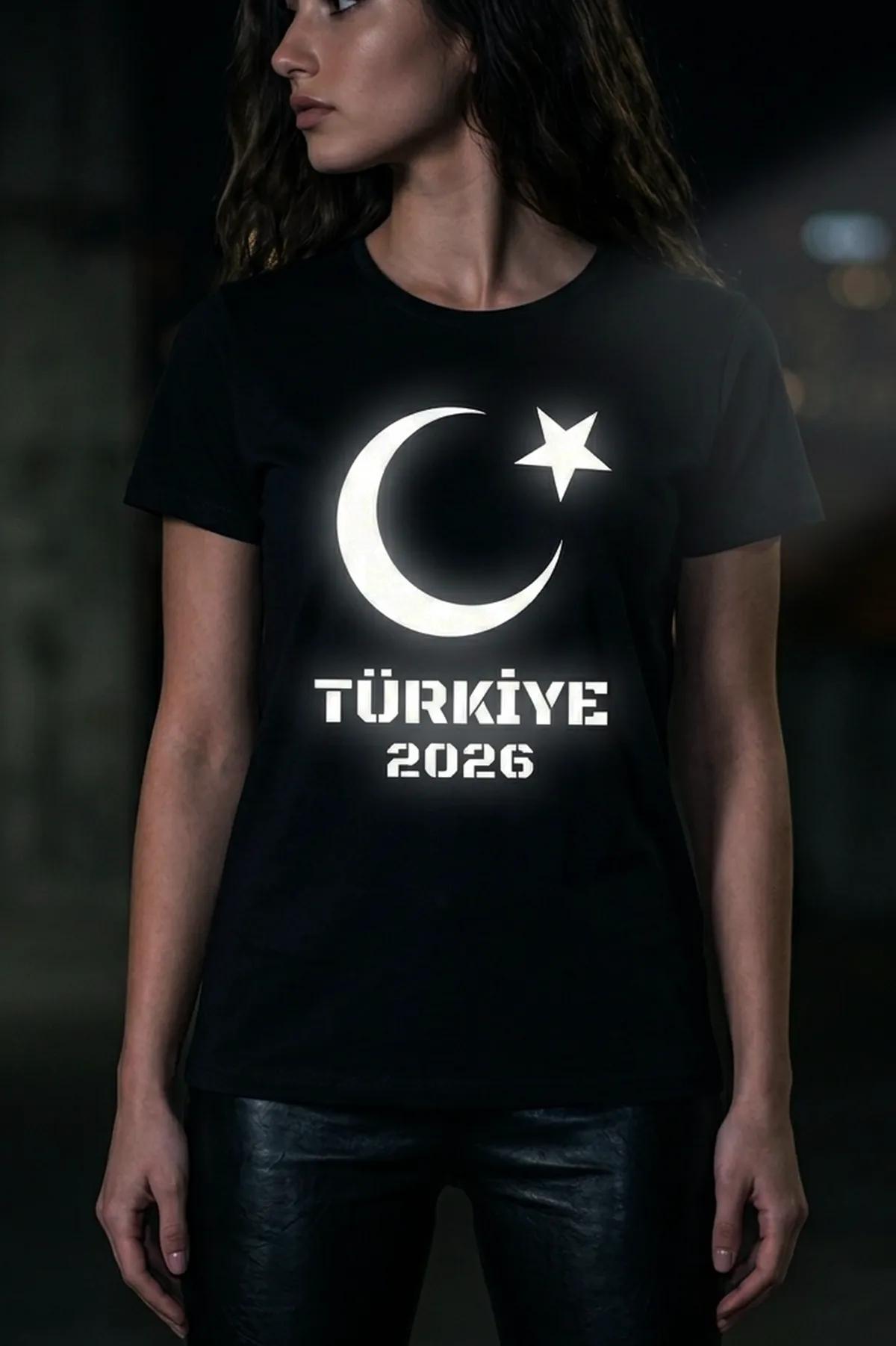 black women's crew-neck t-shirt with large glowing white crescent star and Türkiye 2026 stencil print on chest