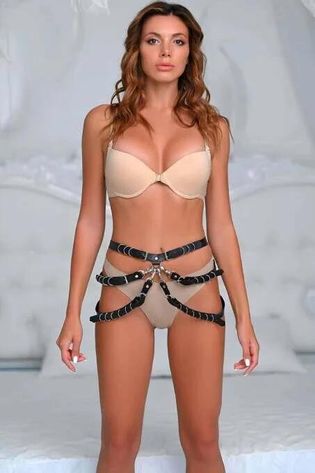 Black faux leather O-ring body harness with waist and thigh strap bands and silver hardware
