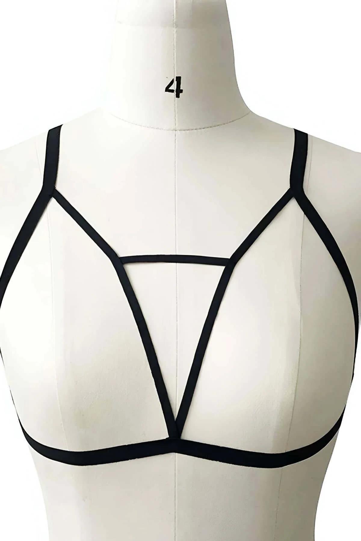 Black strappy cage bralette harness adjustable geometric triangle elastic panel front view on dress form