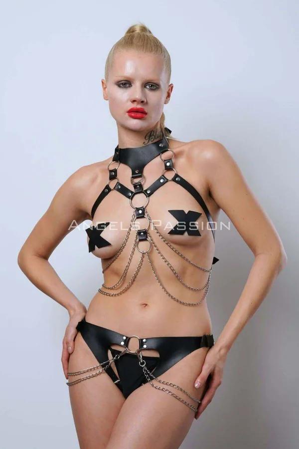 Black faux leather harness set with choker, silver O-ring chest straps, draped link chains, and matching chain-detail brief