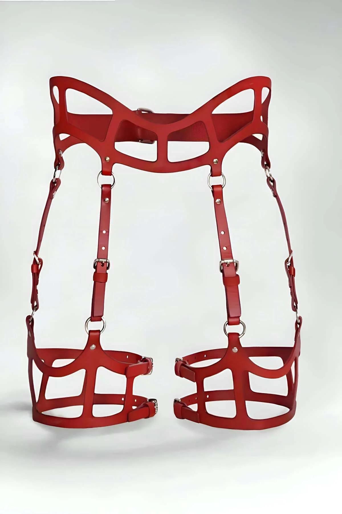 Red faux leather caged high-waist garter harness with die-cut waist panel and adjustable thigh cage bands, silver-tone buckle