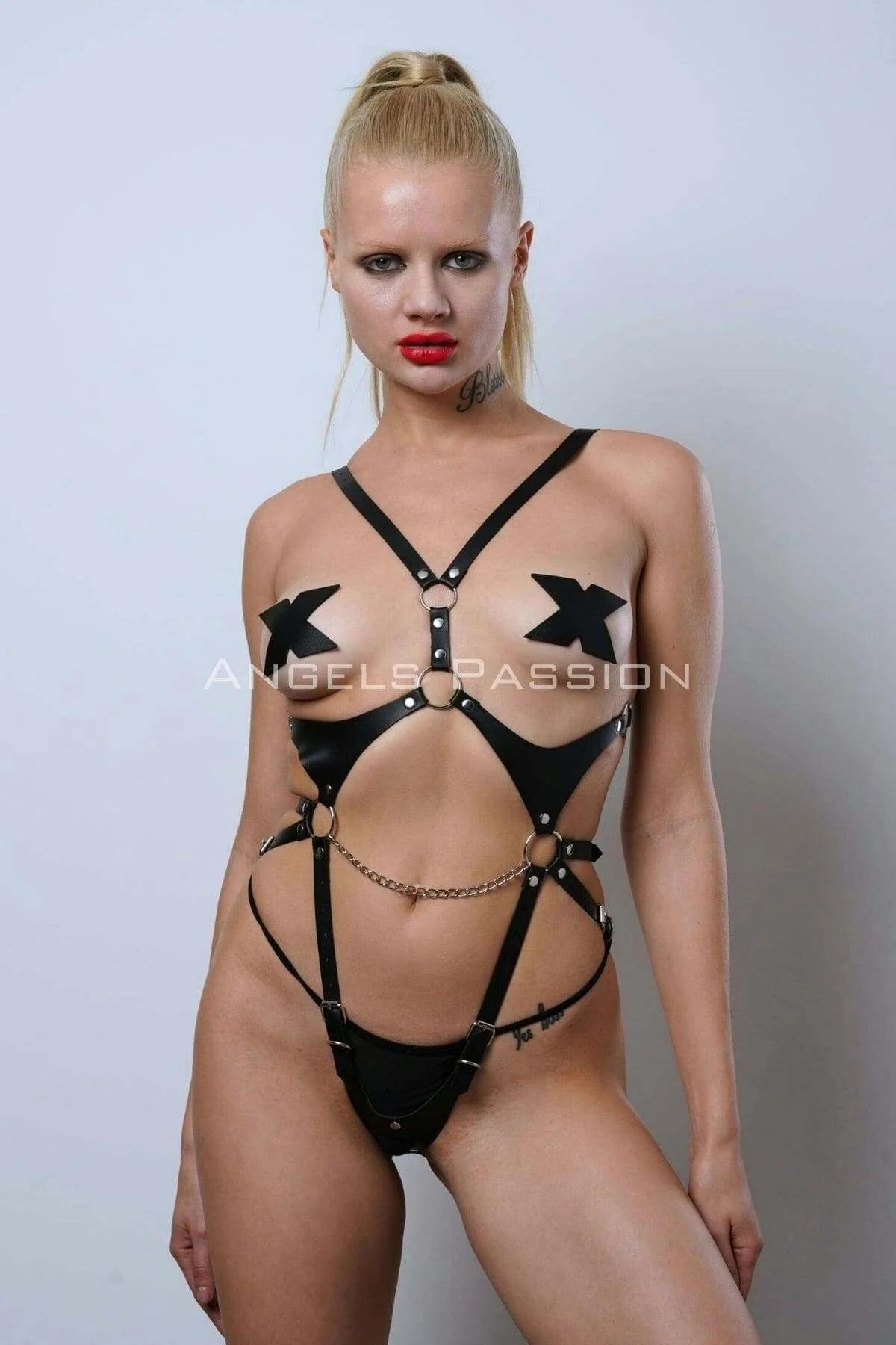 Black faux leather full body harness with detachable gold-tone chain and silver O-rings, front view