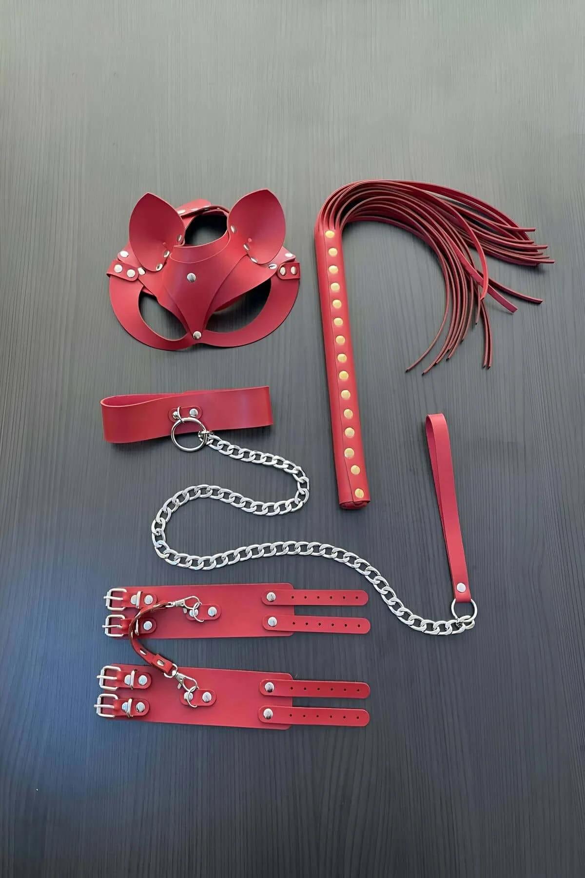 Red faux leather 5-piece set with cat-ear mask, collar with silver chain leash, double-buckle wrist cuffs, and tassel whip la