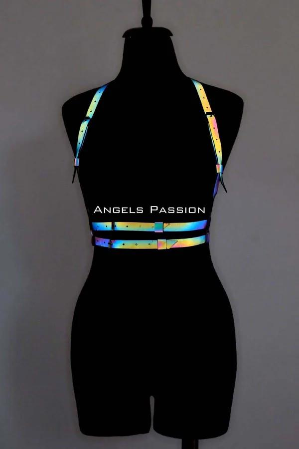Reflective rainbow body harness with iridescent color-shift straps and matte black buckle hardware on mannequin