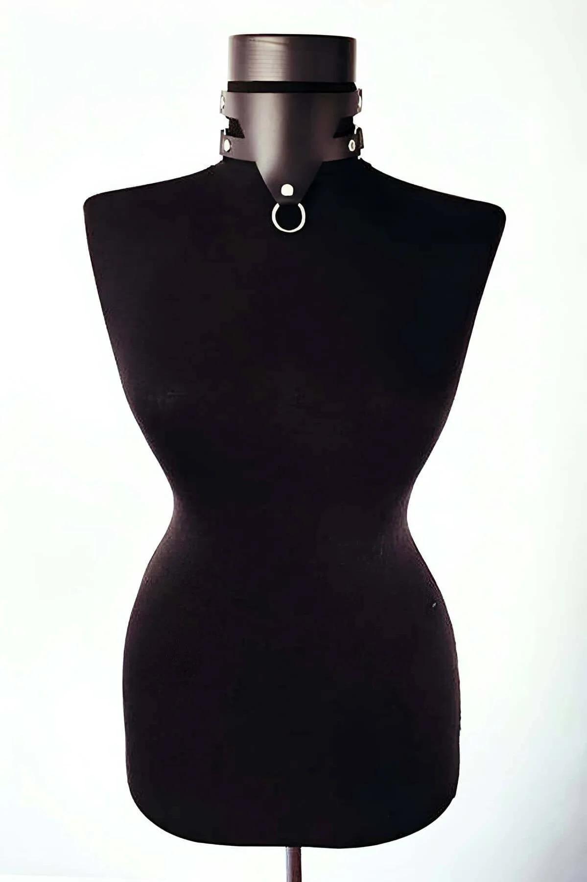 black faux leather wide collar choker with silver O-ring and metal studs on dress form mannequin