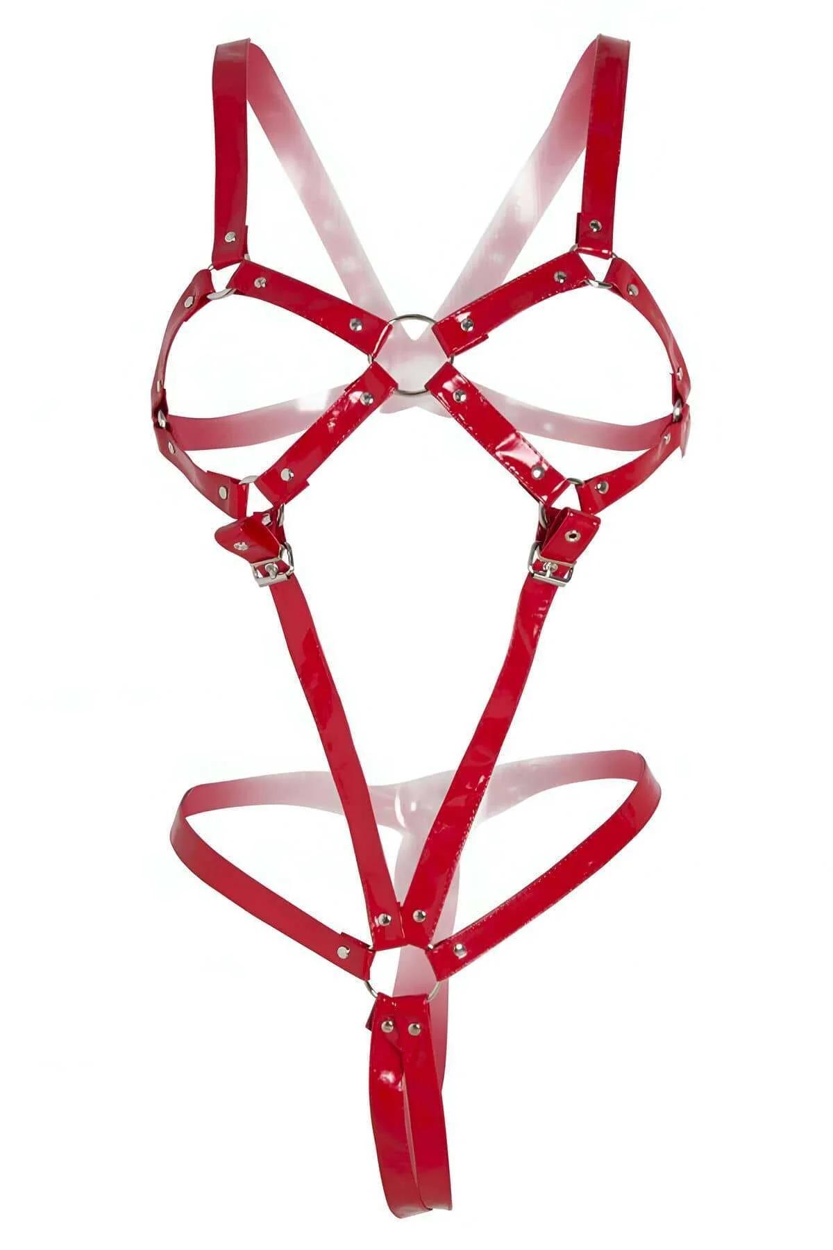 glossy red patent faux leather full body harness with central silver O-ring and adjustable buckles on white background
