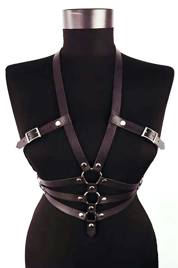 Black faux leather body harness with dual O-rings and silver buckles, multi-strap waist bands on mannequin