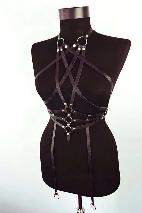 Black faux leather full body harness with crisscross chest straps, triple O-ring waist cluster, and four garter strap extensi