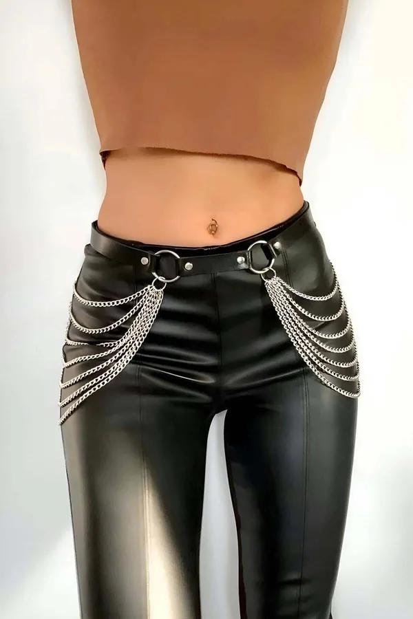 Black faux leather chain belt with silver O-ring accents and cascading multi-strand chains worn at waist