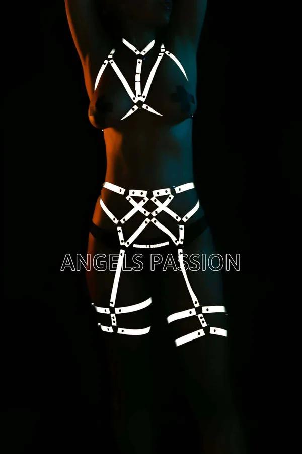 Reflective full body harness white glowing straps chest cage X-cross waist panel and thigh bands in low light