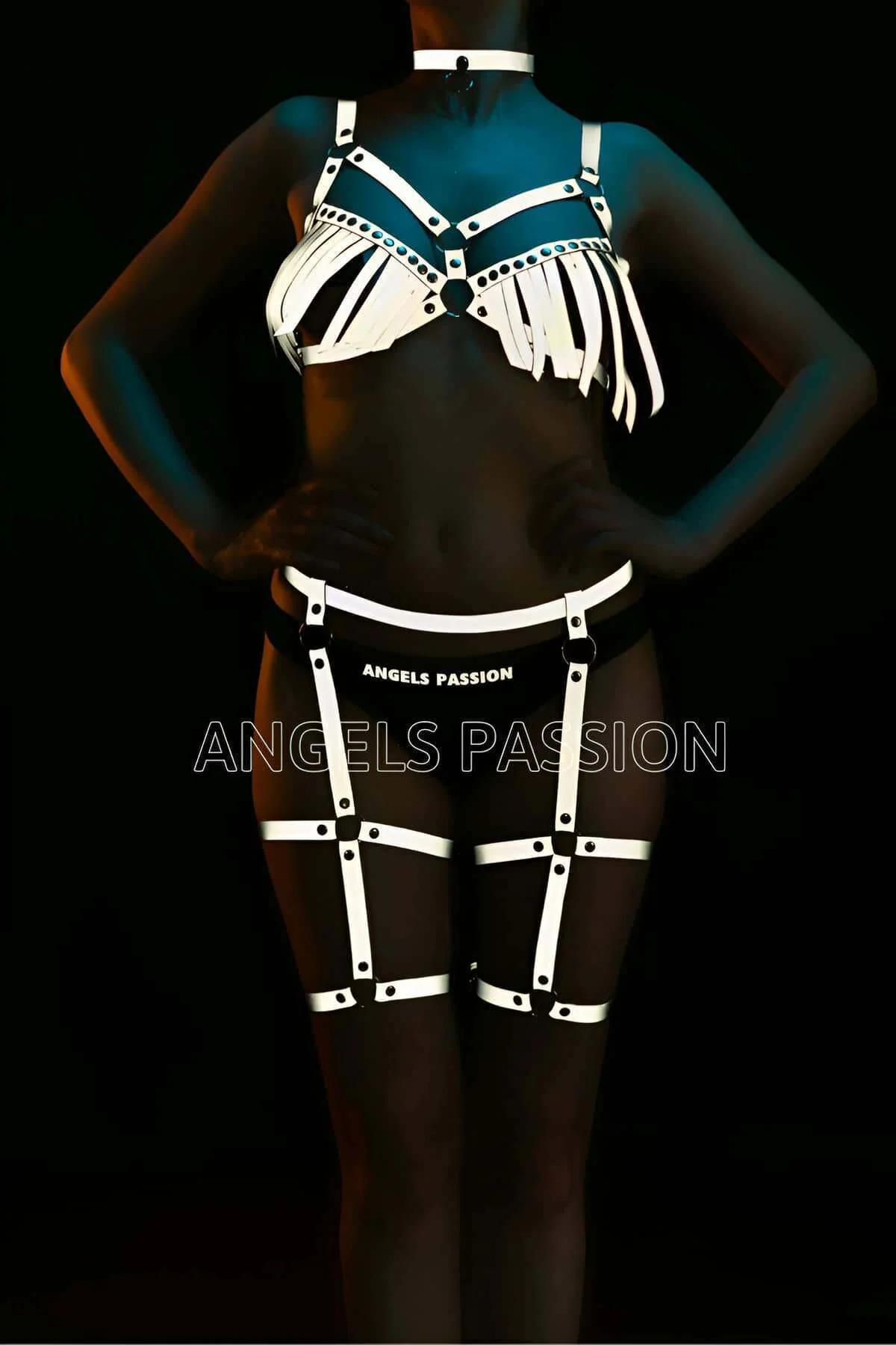 Reflective white full body harness set with fringe bra, choker, waist belt and caged thigh garters under UV lighting