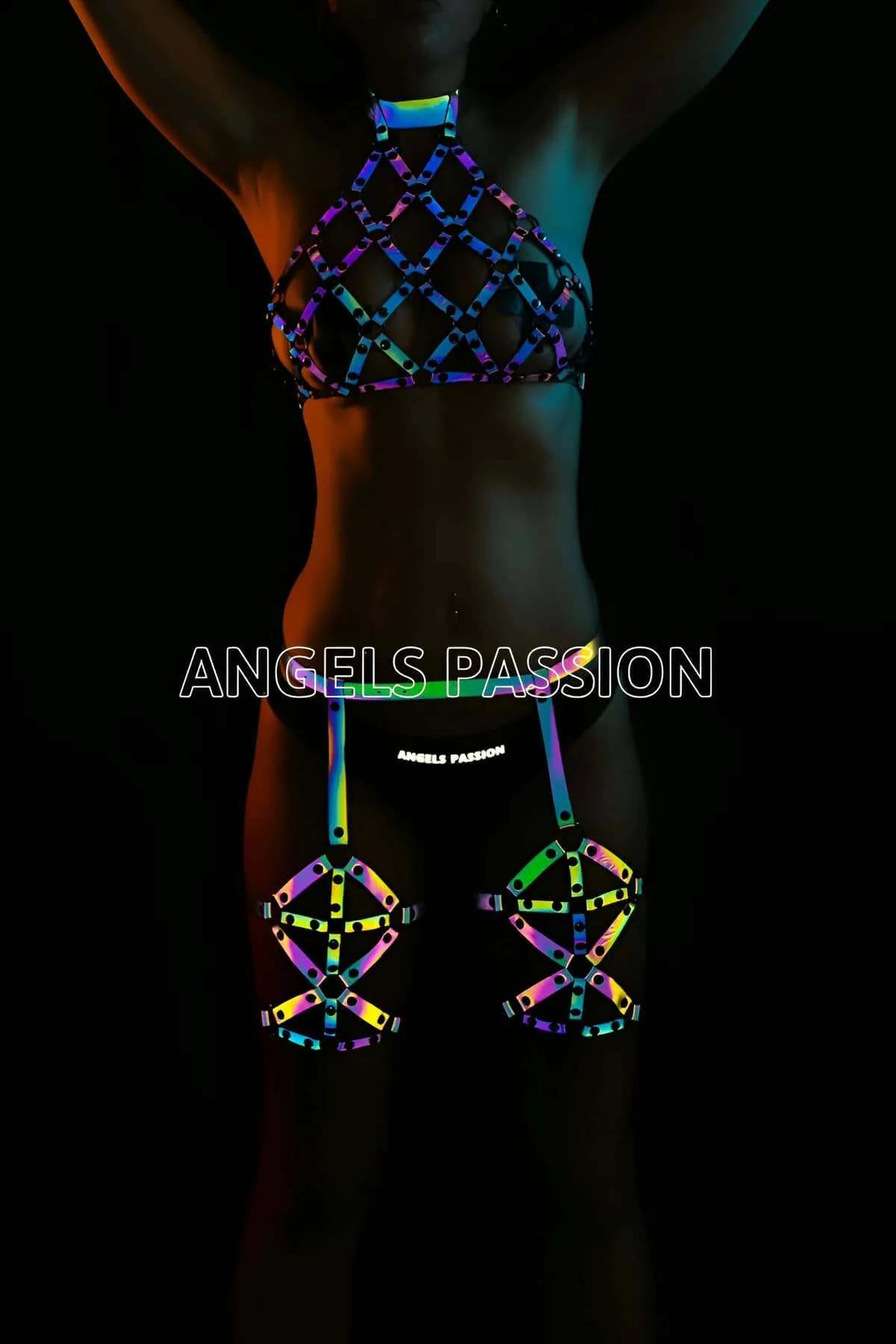Iridescent reflective full body harness with diamond lattice chest cage and thigh pieces glowing green blue purple under UV l