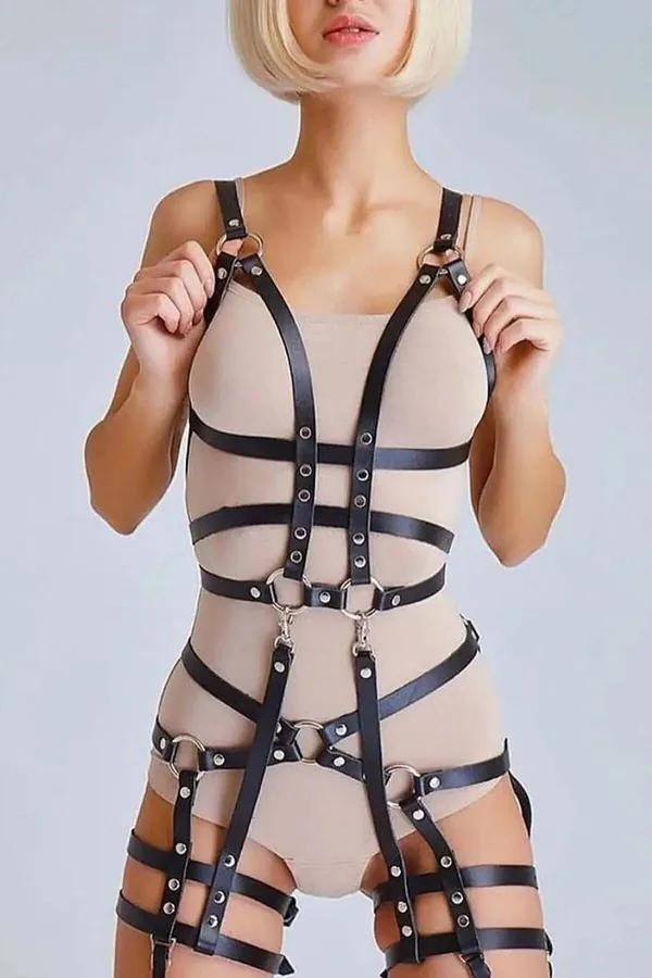 Black faux leather full body harness with silver O-rings and rivet studs covering torso and upper thighs