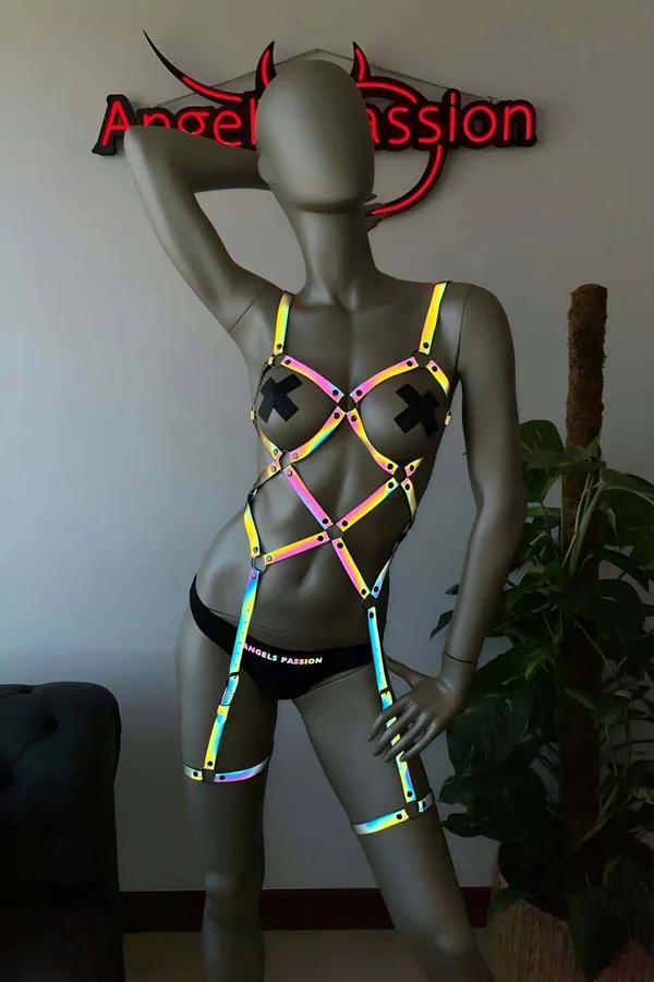 Iridescent rainbow reflective full body harness with geometric cage strap layout on torso and thigh bands, silver rivet hardw