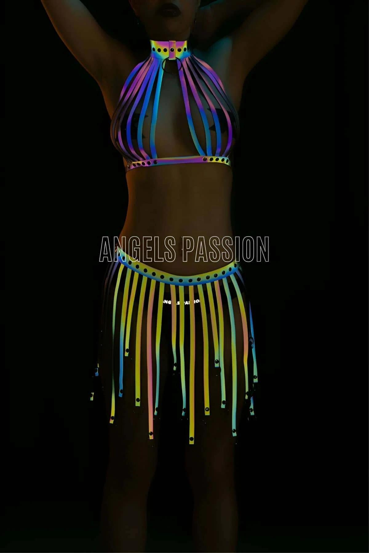 Multi-color reflective halter top and tassel skirt set glowing neon rainbow under UV blacklight with rivet hardware