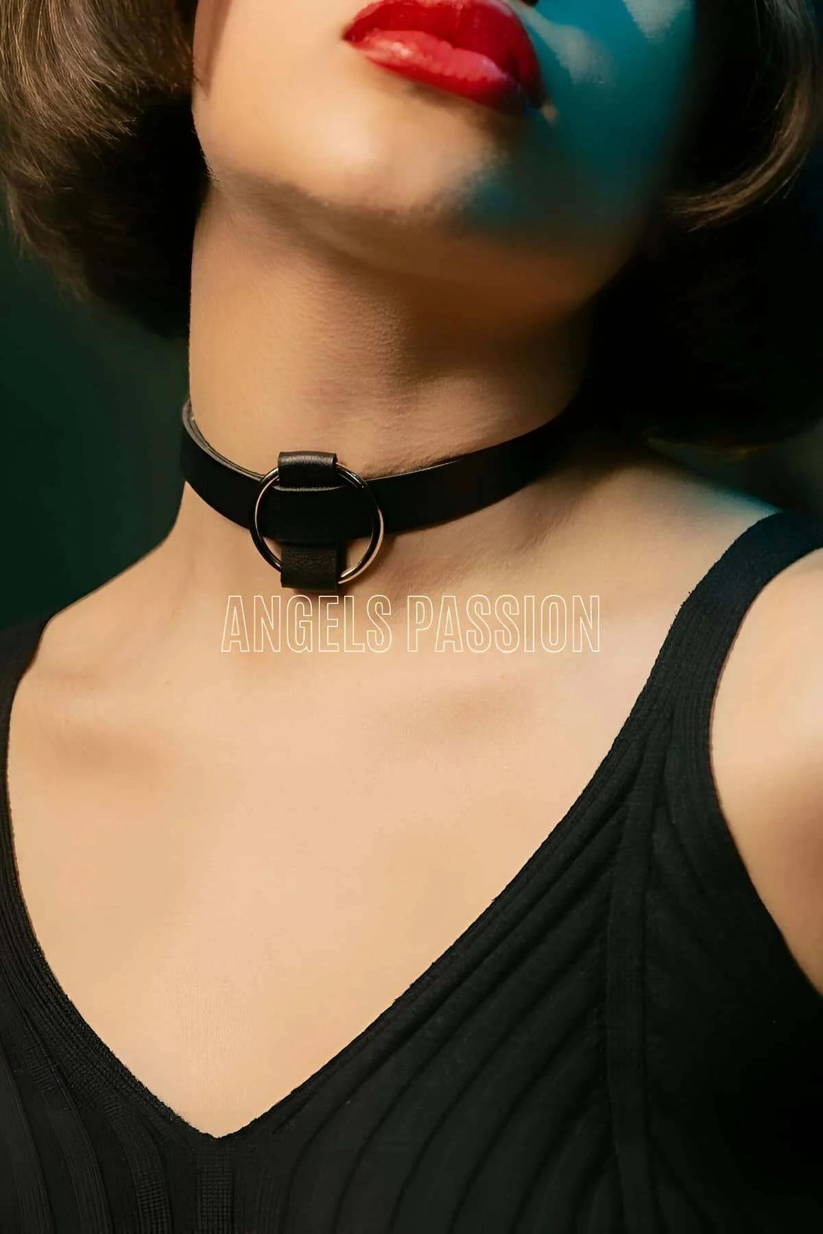 black faux leather o-ring choker necklace with silver ring hardware worn at the throat