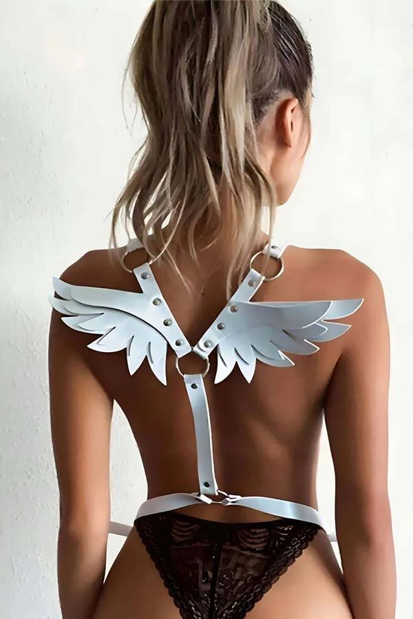 White faux leather angel wing body harness with silver O-rings shown on back, layered feather cut-out panels