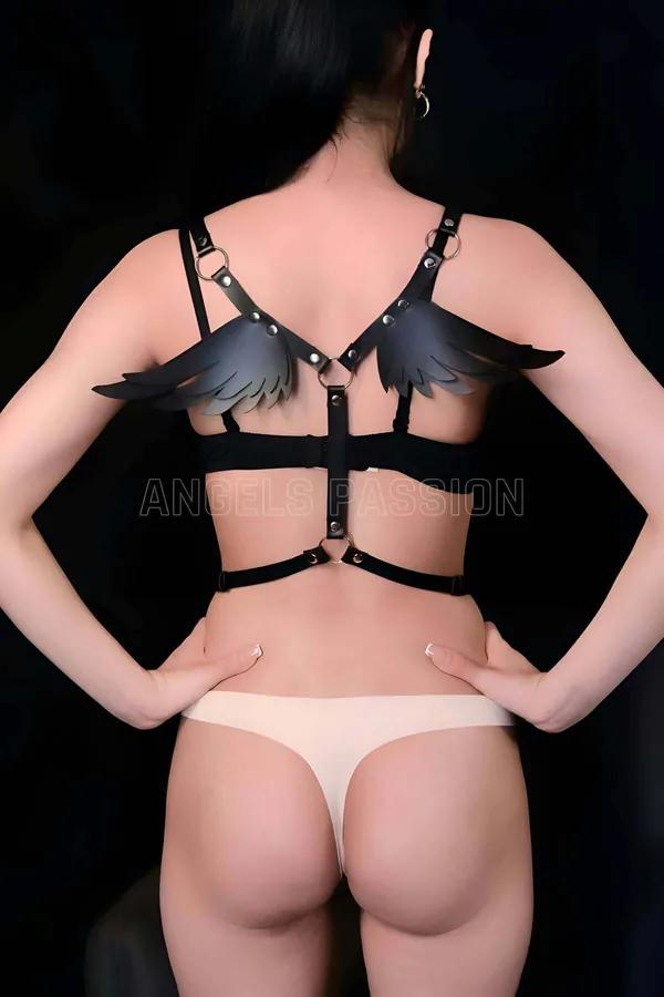 Black faux leather winged body harness back view with silver O-rings and adjustable torso straps