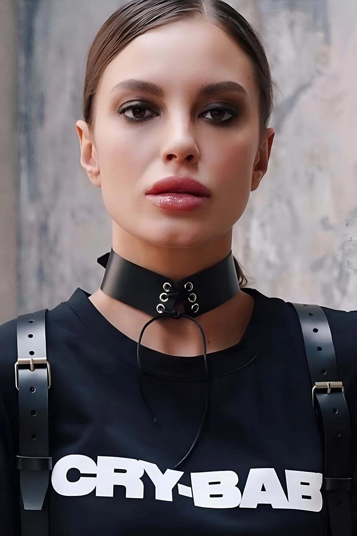 black faux leather wide choker with silver eyelets and lace-up front cord worn on neck