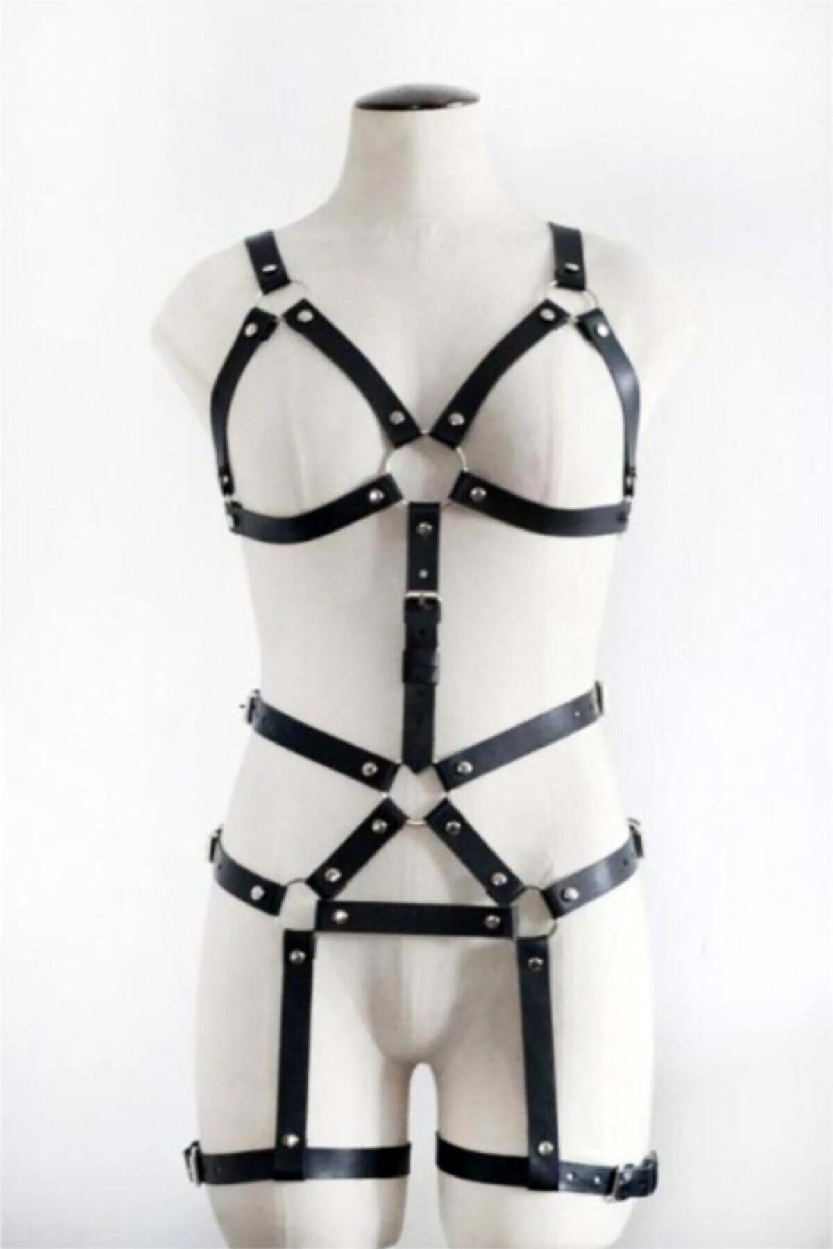 Black faux leather full body harness with silver O-rings, chest cage, waist band, and thigh garters on mannequin