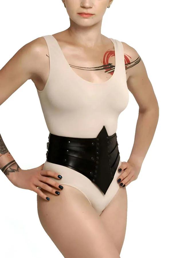 black faux leather V-cut waist cincher with silver rivet studs multi-panel structured design worn over cream bodysuit
