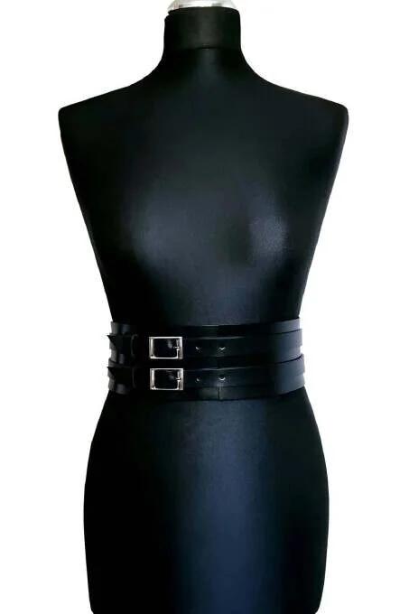 Wide black faux leather waist belt harness with two silver rectangular buckles on mannequin
