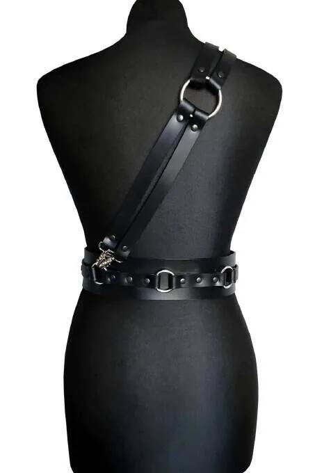black faux leather shoulder and waist harness with silver D-ring accents shown from back on mannequin