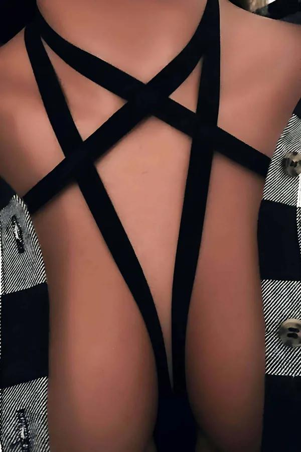 black elastic star body harness with five crossing flat straps forming geometric pattern on chest