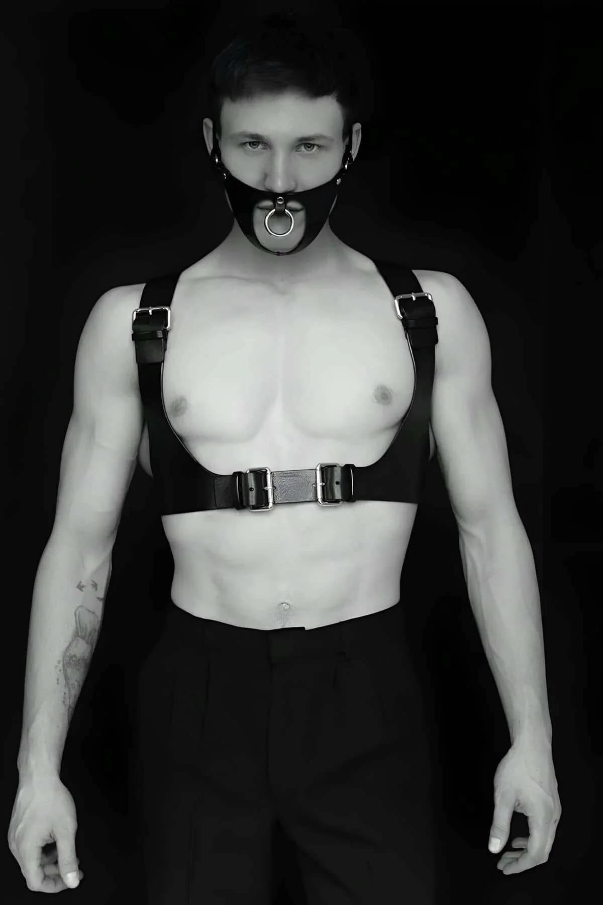 Black faux leather mens body harness with detachable silver O-ring gag mask and dual buckle chest band