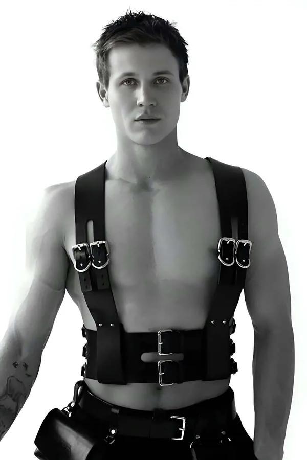 Black faux leather chest harness with dual silver buckles on chest and wide waist belt worn by male model