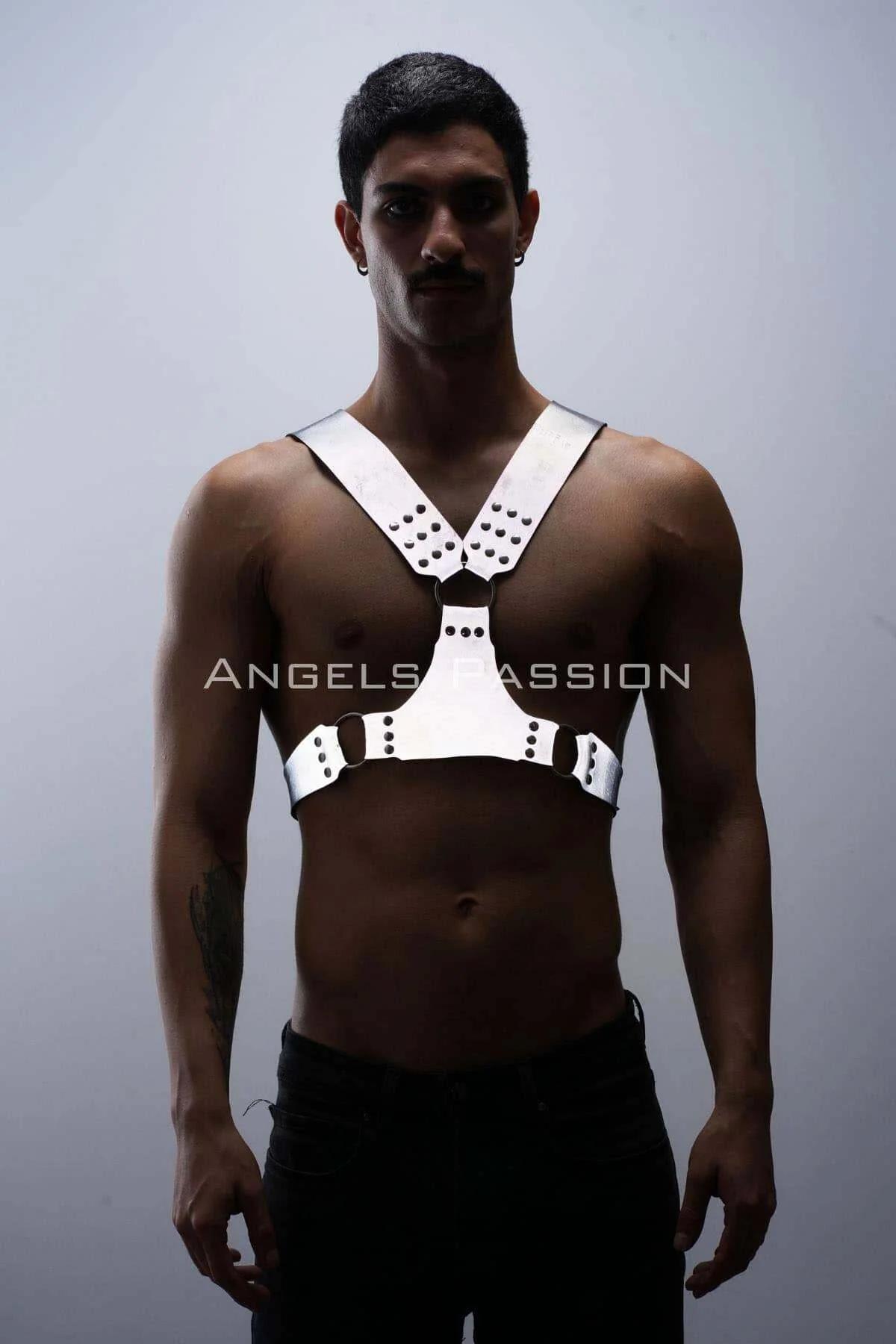 White reflective chest harness with dark O-ring accents and rivet studs worn by male model — Y-strap silhouette
