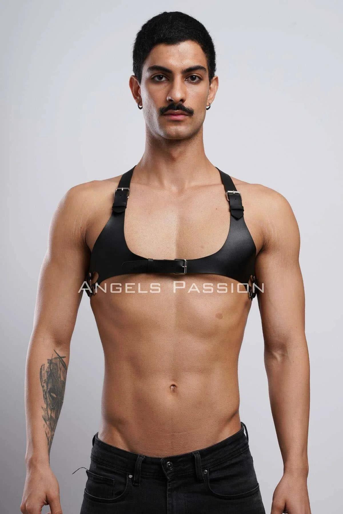 black matte faux leather chest harness wide front panel adjustable buckle straps worn by male model
