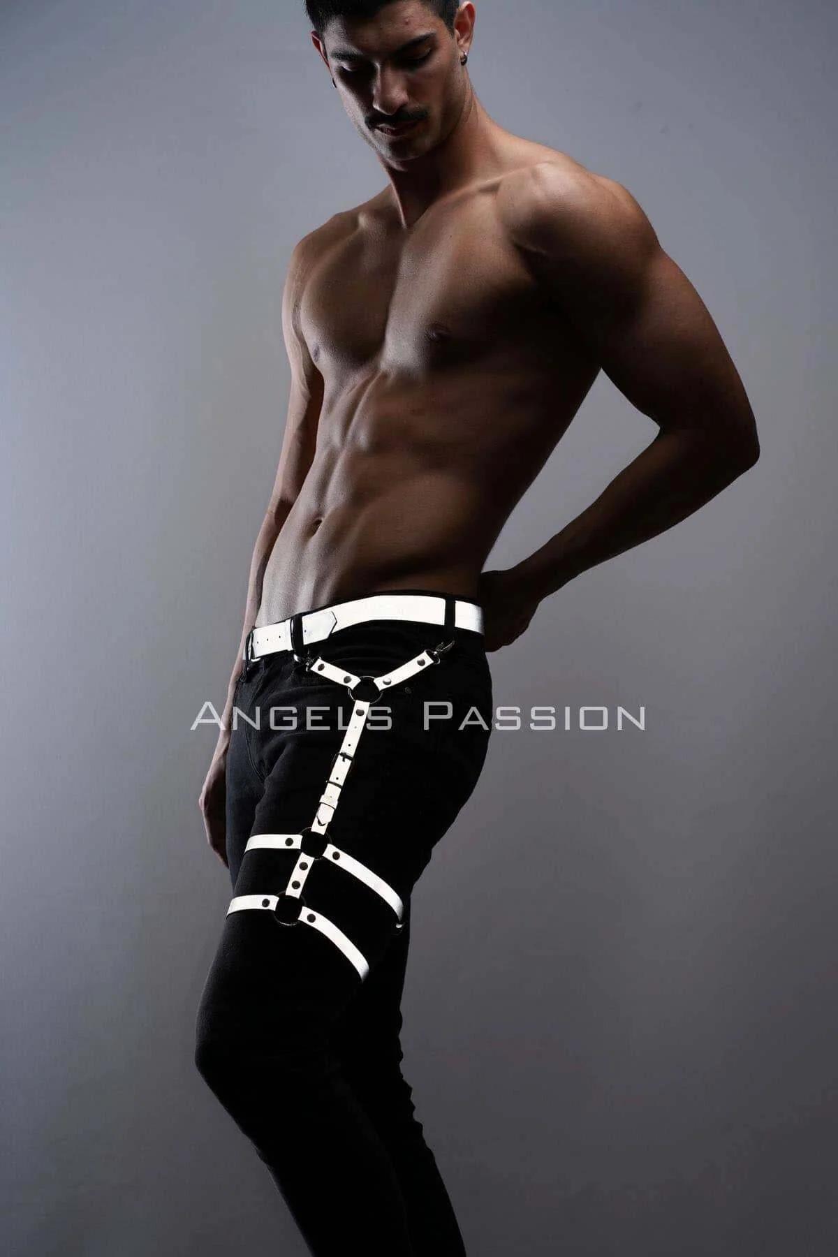 White reflective leg harness with silver D-rings and Y-strap thigh design worn over black trousers