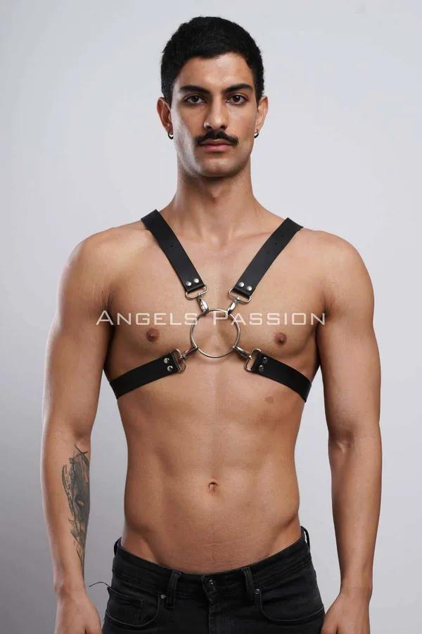 Black faux leather chest harness with silver O-ring and X-back straps worn by male model
