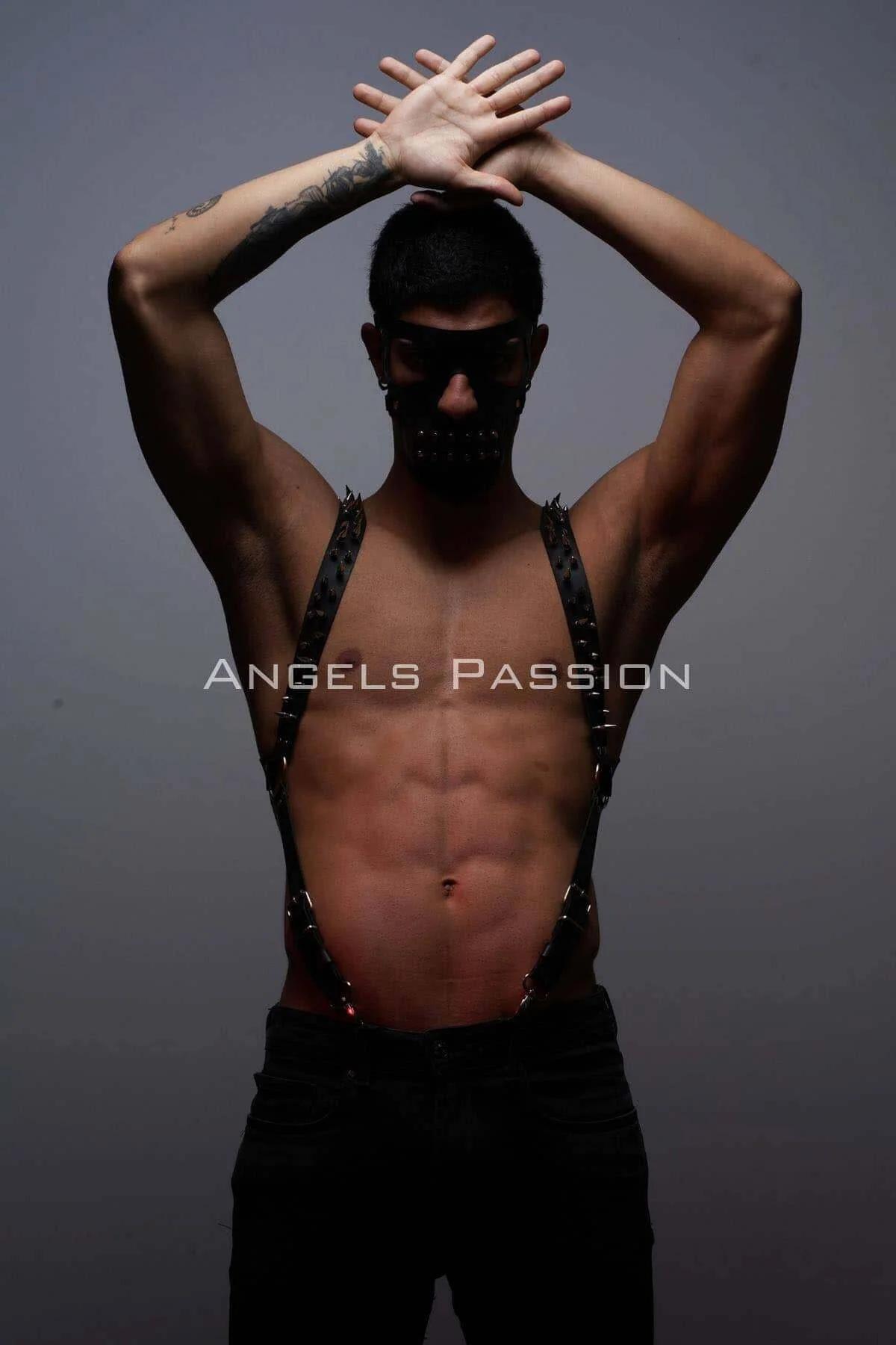 black studded faux leather suspenders harness with silver pyramid spike studs and O-ring waist clips worn on male torso