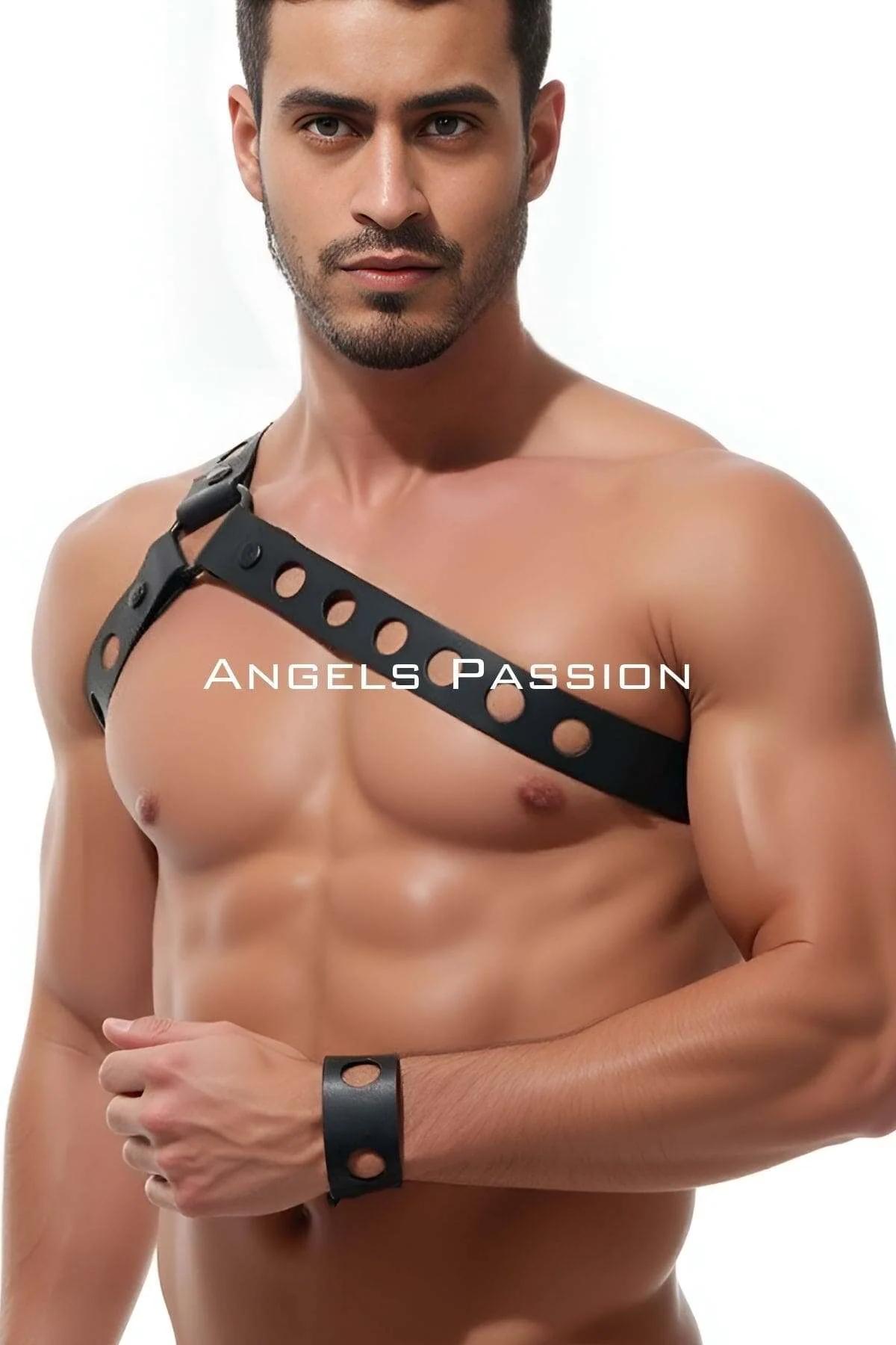 black faux leather asymmetrical chest harness with punched grommet holes diagonal single strap worn by male model