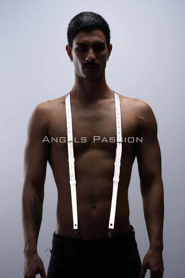White reflective suspenders harness with perforated faux leather straps and silver clasps worn on male torso