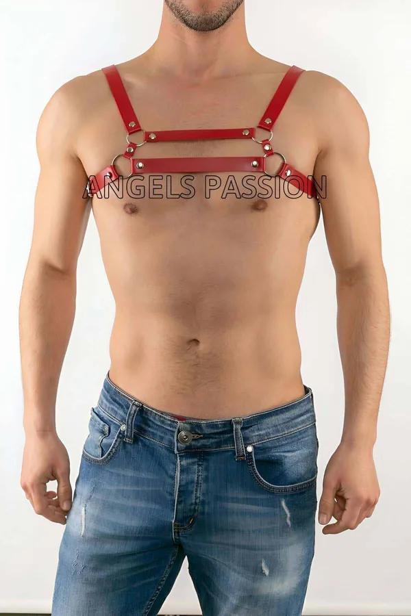 Red faux leather chest harness with four silver O-rings and adjustable shoulder straps worn by male model